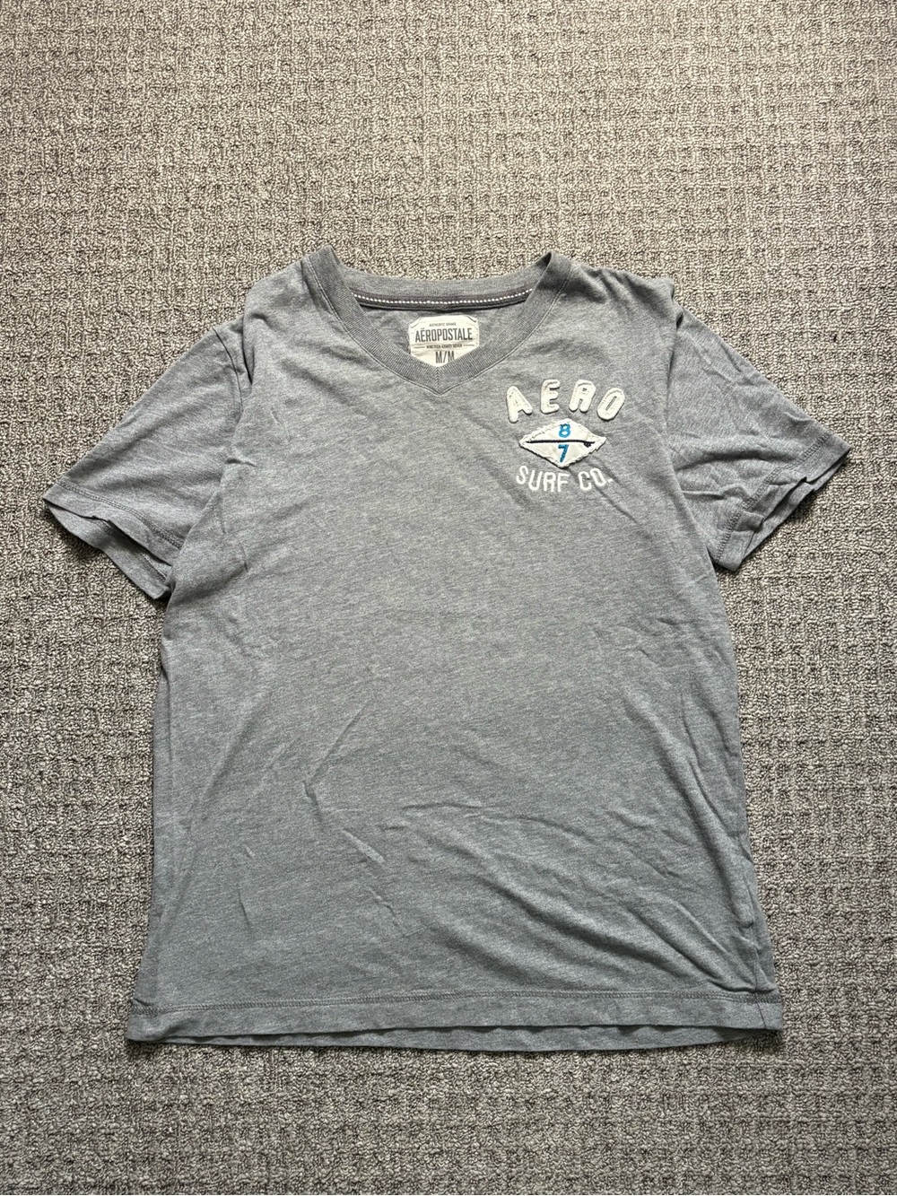 Y2K 2000s style Aero Surf Distressed Spellout Tee | $25
